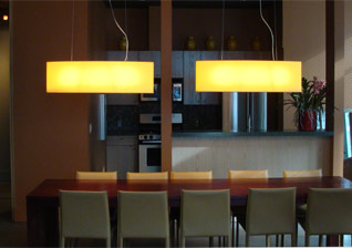 Ellington Condominiums dining room with staggered glass pendants